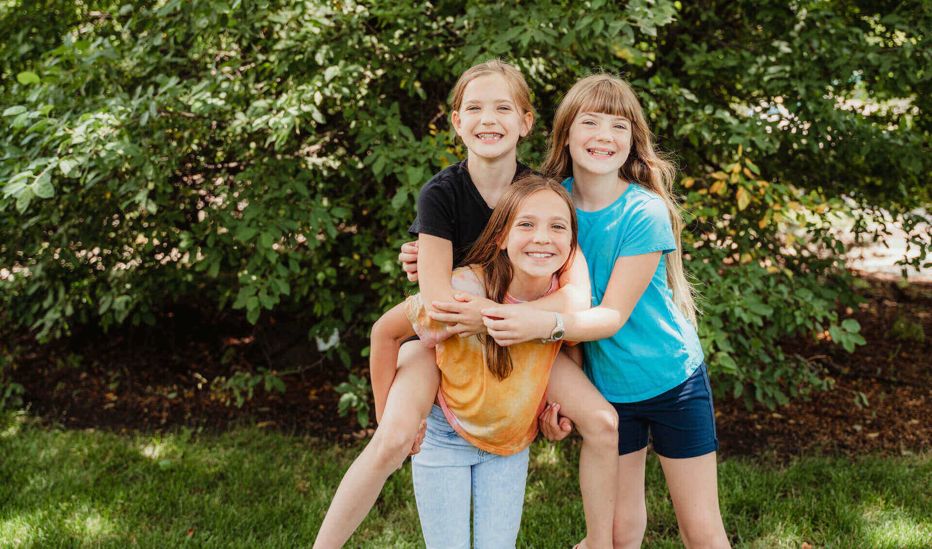 three children smiling