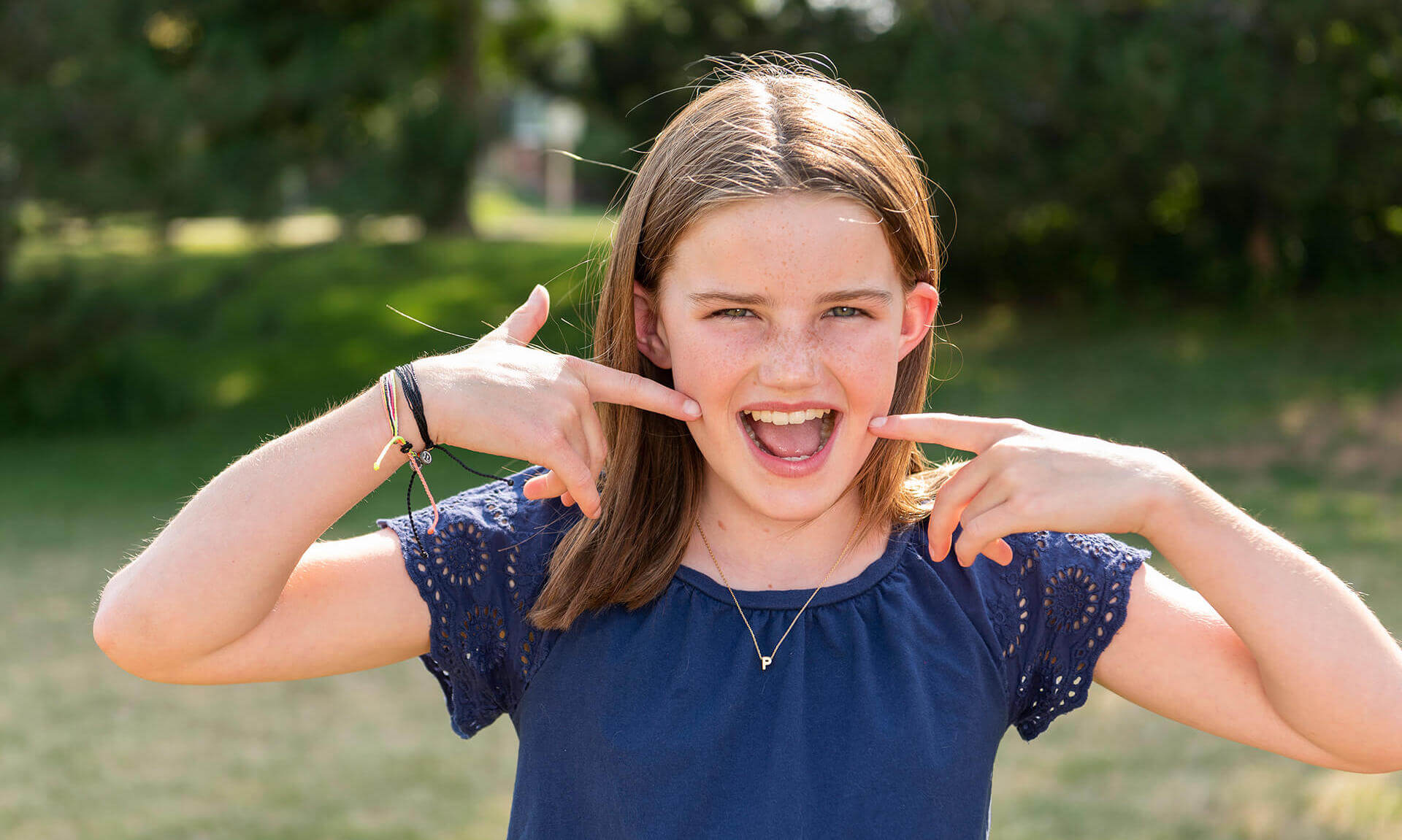 young girl with braces smiling