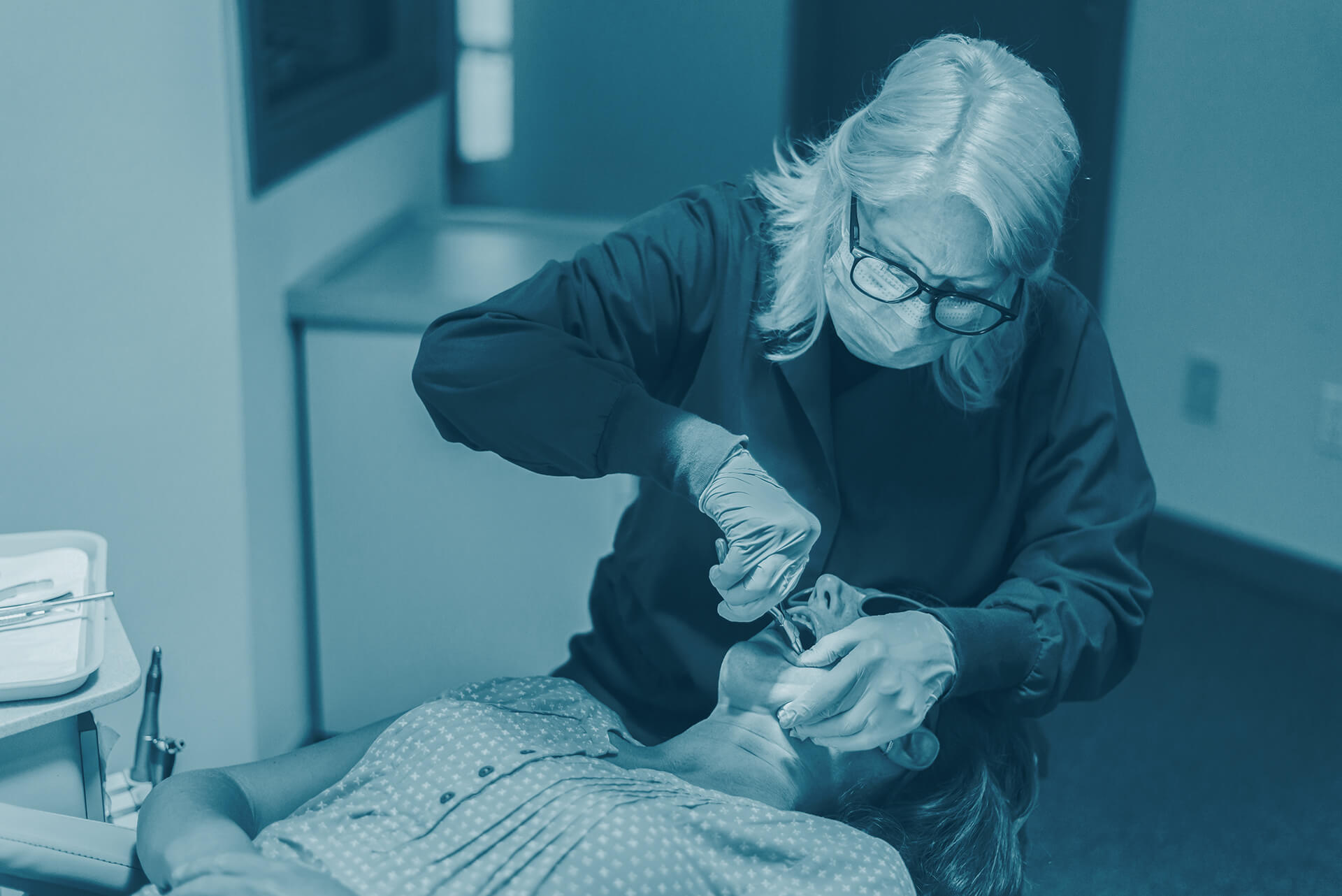 orthodontist working on patient